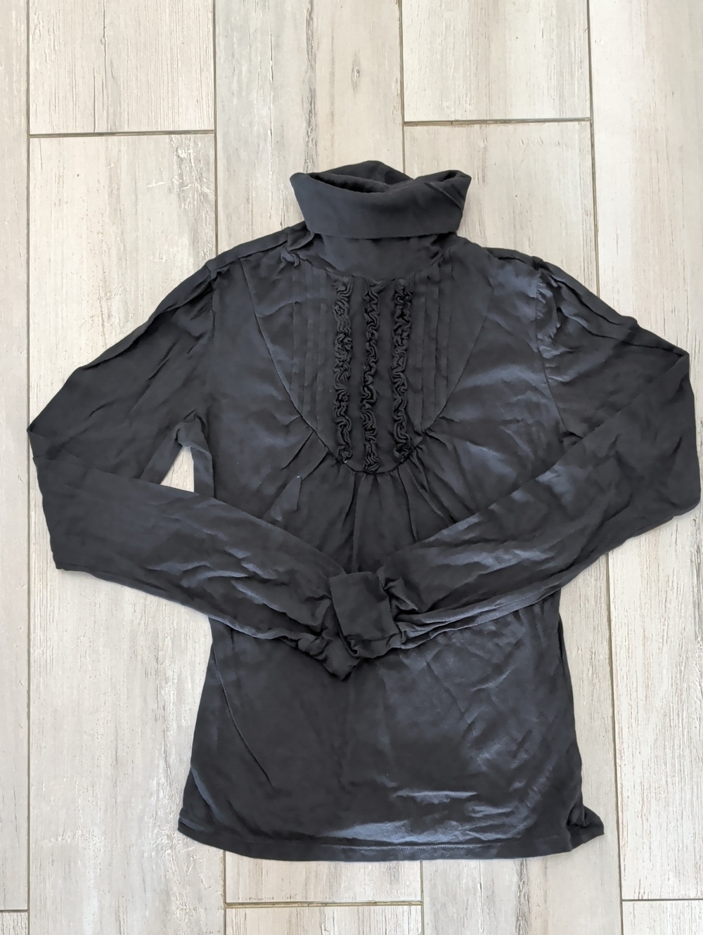 VETTA Black Garment with White Embossed Brand Tag